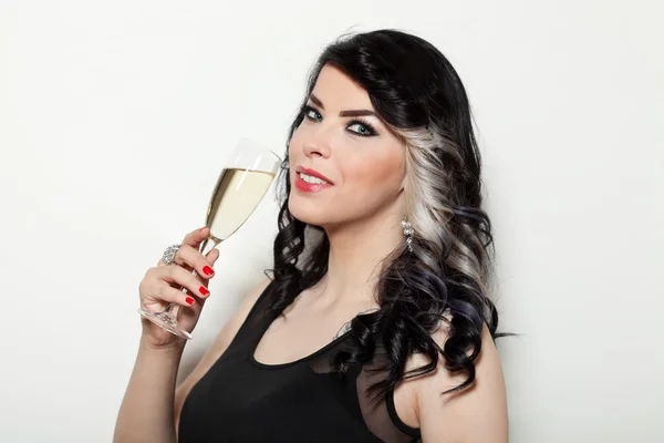 Beautiful young woman	celebrating with a glass of champagne — Stock Photo, Image